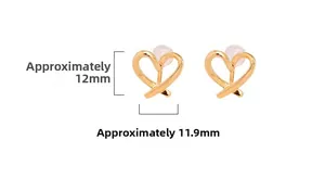 Macro detail of heart-shaped gold clip-on earrings with clear dimensions and silicone pad