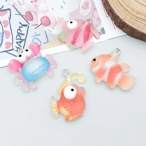 Detail of colorful resin marine animal charms including tropical fish and crab for DIY jewelry