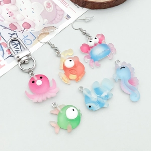 Close-up of matte resin marine animal charms including octopus and tropical fish for DIY