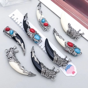 Vintage silver-plated tooth charms with turquoise insets and wolf head engravings