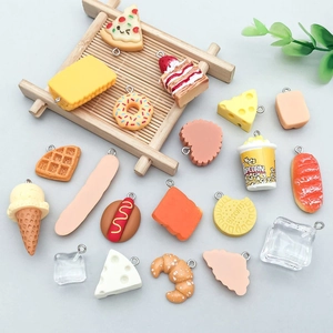 Detailed view of assorted resin miniature food charms with metal rings for DIY jewelry making