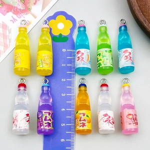 Set of 10 colorful resin soda bottle charms for DIY jewelry with a scale ruler