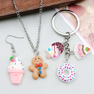 Detailed close-up of resin dessert charms featuring ice cream and donuts for DIY jewelry