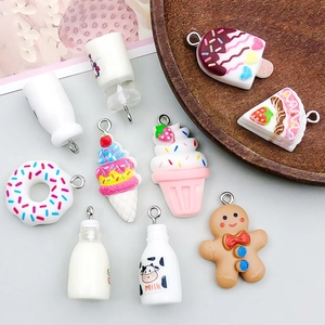 Detailed view of colorful resin dessert charms including donuts and cakes for DIY jewelry