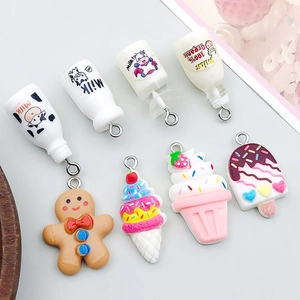 Detailed macro view of assorted resin ice cream and gingerbread man DIY pendants