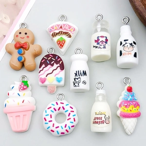 Assorted resin charms including milk bottles and gingerbread man for DIY jewelry
