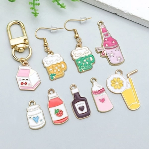 Flat lay of colorful enamel alloy beverage pendants for DIY jewelry and bracelets