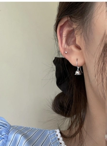 Close-up of lily of the valley silver drop earrings on model for a delicate floral look