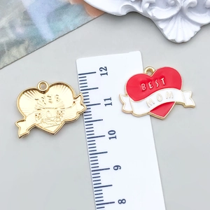 Detailed macro view showing dimensions of heart-shaped Best Mom enamel pendant charms