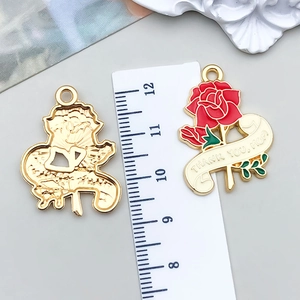 Detailed view of pink rose enamel pendant with Thank You Mom text and ruler measurement