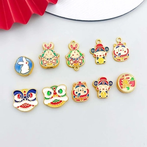 Detailed close-up of colorful enamel Chinese folk pendants including rabbit and lion charms