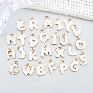 DIY set of 26 white enamel A-Z alphabet pendants with gold trim for jewelry making