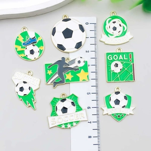Green and gold enamel football charms for DIY necklaces with soccer theme and goal text