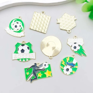 Detail of green enamel soccer charms for DIY jewelry making with gold-plated finish