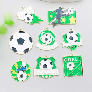 Detailed macro of green enamel football charms for DIY bracelets and jewelry