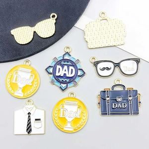 Detailed view of colorful enamel Father's Day alloy charms for DIY jewelry making