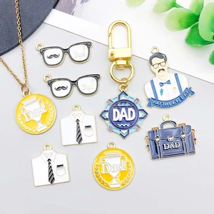 Detail of enamel Father's Day charms featuring Dad glasses and tie pendants