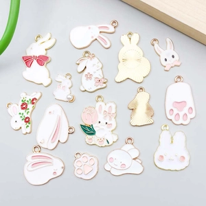 Pink and white enamel bunny charms for DIY jewelry making with gold plated alloy edges