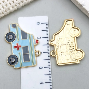 Detailed front and back view of 30mm light blue enamel ambulance charms for DIY jewelry