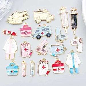 Assorted colorful enamel medical charms including ambulance and doctor coat for DIY crafts