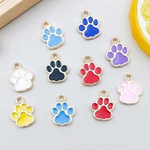 Close-up of colorful cat paw alloy charms with gold plating and enamel for DIY jewelry