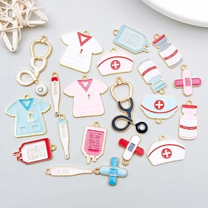 Macro view of colorful enamel medical charms including stethoscope and nurse cap
