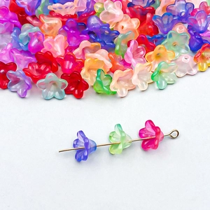 Macro shot of colorful translucent acrylic lily-of-the-valley flower beads for DIY jewelry