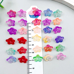 Colorful acrylic lily of the valley flower pendants with ruler showing 10mm size