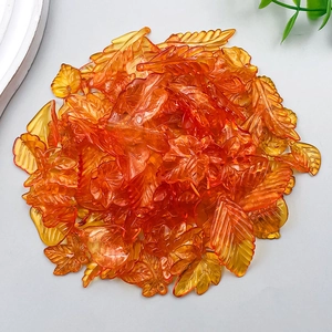 Mix of translucent orange acrylic leaf pendants with detailed veins for DIY jewelry making