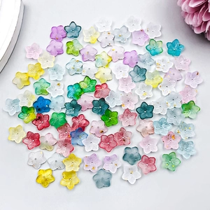 Close-up of assorted colorful acrylic cherry blossom charms with gold foil inside