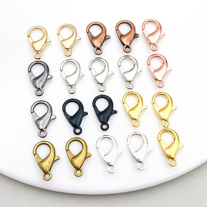 Macro shot of 20 alloy lobster clasps in 7 metal colors arranged in a neat grid pattern