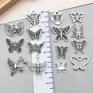 Set of 15 vintage silver butterfly charms for DIY jewelry making with size reference