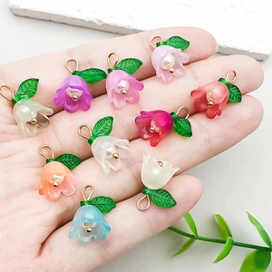 Colorful acrylic lily of the valley flower pendants with pearl inlay on palm