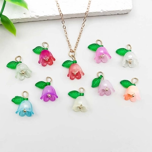 Detailed close-up of colorful lily of the valley acrylic pendants for DIY jewelry making