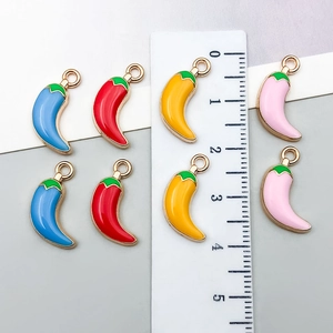 Mix of 20 colorful chili pendants with gold edges and scale showing 2.5cm size