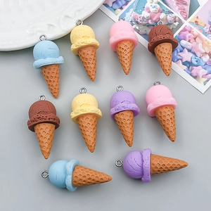Detailed close-up of resin ice cream cone pendants in pastel colors for DIY jewelry