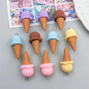 Detailed view of colorful resin ice cream cone charms with silver metal loops for DIY crafts