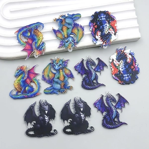Flat lay of ten colorful acrylic double-sided dragon pendants for DIY jewelry making