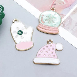 Detail of Christmas glove, snow globe and hat pendants for DIY jewelry making