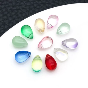 Detailed view of colorful teardrop glass beads with horizontal holes for DIY jewelry