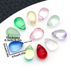 Macro detail of 10 teardrop glass beads showing precise 0.9cm size and 1mm drill hole