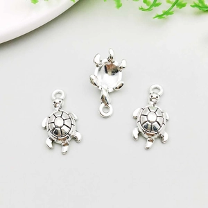 Detailed view of antique silver sea turtle charms for DIY necklaces and jewelry making