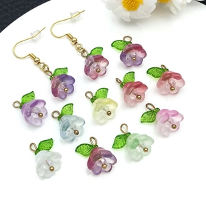 Macro shot of colorful lily of the valley glass flower charms for jewelry making