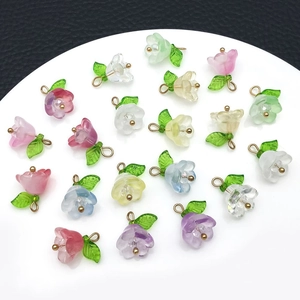 Detailed macro view of colorful bell orchid lily flower charms for DIY jewelry making