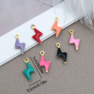 Detailed view of colorful lightning bolt pendants with size markings for jewelry making