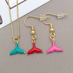 Detail of colorful enamel mermaid tail pendant set with gold plated necklace and earrings