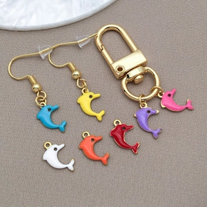 Detail of colorful enamel dolphin charms and DIY jewelry accessories in assorted vibrant colors