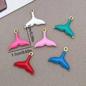 Macro shot of colorful enamel mermaid tail pendants with specific size measurements