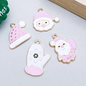 Detailed macro view of pink enamel Christmas alloy pendants with Santa and snowflakes