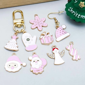 Pink and gold Christmas charms collection with snowflakes, trees and angels for DIY jewelry
